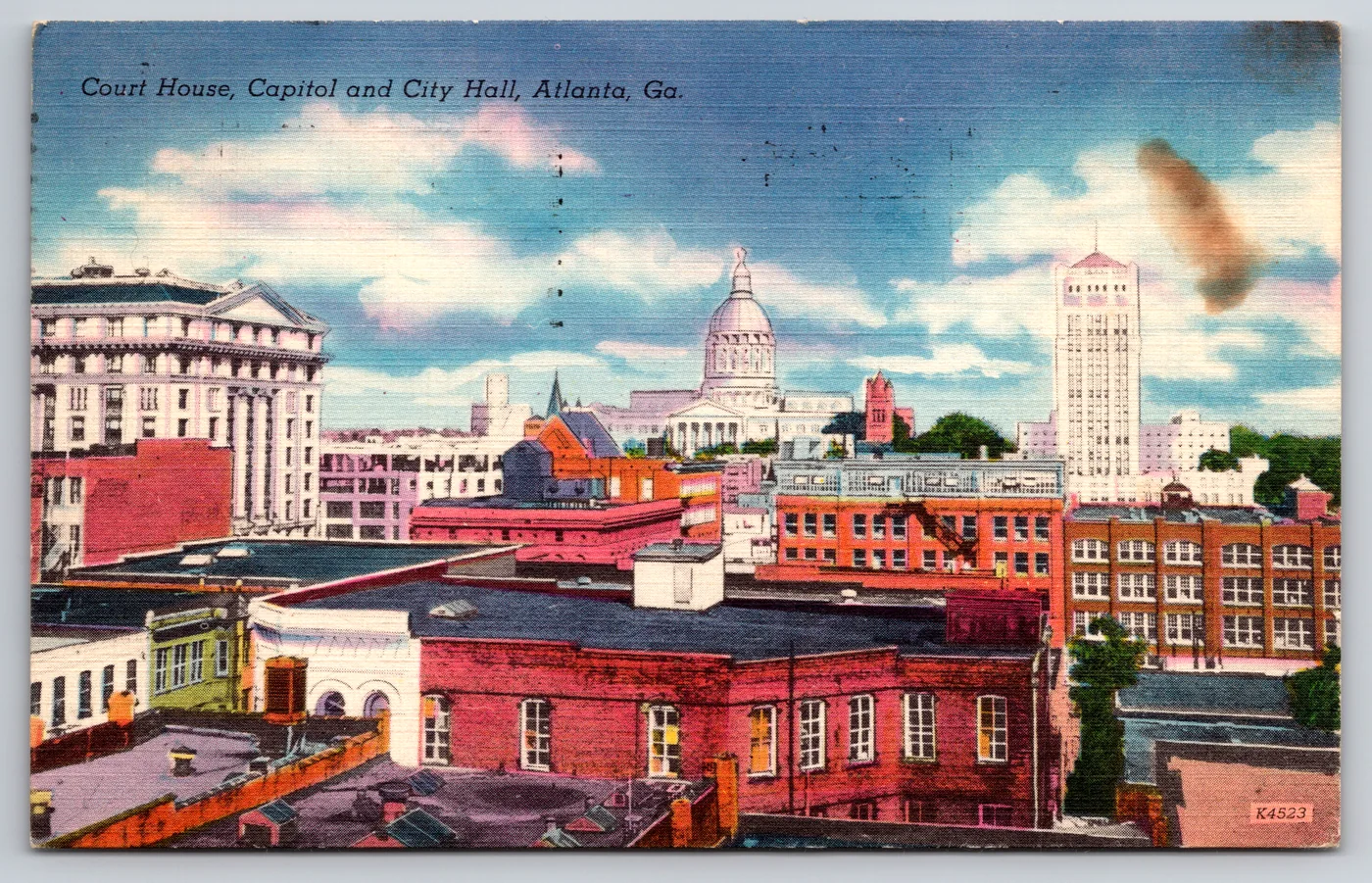 The front of a Colourpicture-printed postcard from the Postcard Origins collection: a multi-view of the Fulton County Court House, State Capitol and City Hall in Atlanta, Georgia