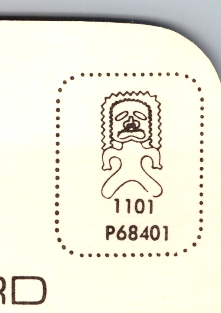 The publisher house stamp box on the same card, a tiki motif