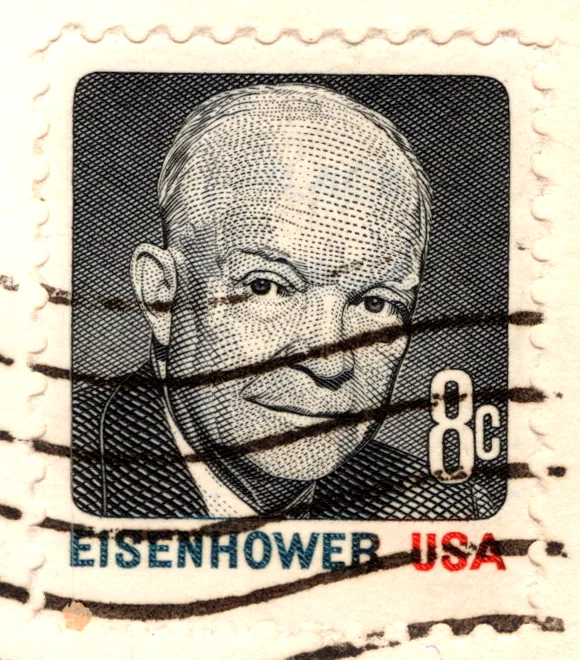 An 8-cent Dwight D. Eisenhower stamp of the Prominent Americans series on a postcard, from the Postcard Origins collection